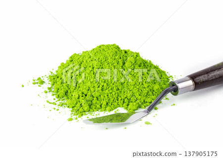 Vibrant Green Powder Spills From Container on White Background in Laboratory Setting Vibrant Green Powder Spills From Container on White Background in Laboratory Setting 137905175