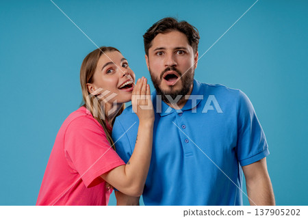 Gossiper Woman Whispers In boyfriends Ear Secret, Rumors, Gossips, Blue Studio 137905202