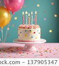A round birthday cake with white frosting, topped with six colorful candles. Sprinkles and confetti surround the cake on a light blue background. 137905347