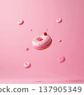 A pink donut with sprinkles and a cherry on top floats in a pink background. Surrounding it are smaller pink donuts, creating a whimsical dessert scene. 137905349