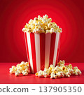 Tasty popcorn in a paper container isolated on a red background. Symbol of cinema, fun, and casual snacking. 137905350