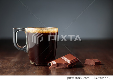 Black coffee and chocolate. Black coffee and chocolate. 137905369
