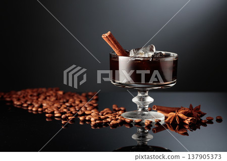 Coffee cocktail with ice on a black background. Coffee cocktail with ice on a black background. 137905373