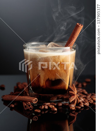 Cold steaming cocktail of cream and coffee on a black background. 137905377