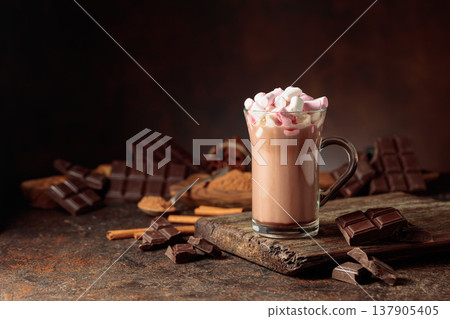 Hot chocolate drink with marshmallows on a brown background. Hot chocolate drink with marshmallows on a brown background. 137905405