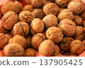 Walnut shells closeup, rustic harvest food backdrop 137905425