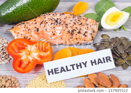 Various nutritious products or ingredients containing vitamins and minerals for healthy hair 137905522