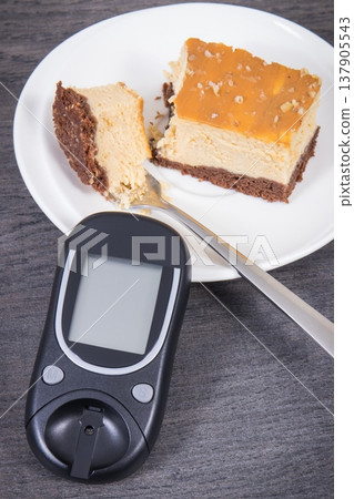 Glucometer and sweet cheesecake. Measuring and sugar level control during diabetes 137905543