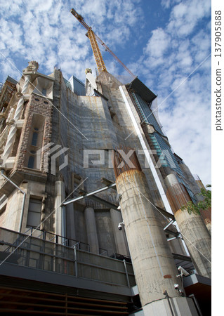 Barcelona, Spain, August 30, 2017: Sagrada Familia under construction with crane Barcelona, Spain, August 30, 2017: Sagrada Familia under construction with crane 137905888