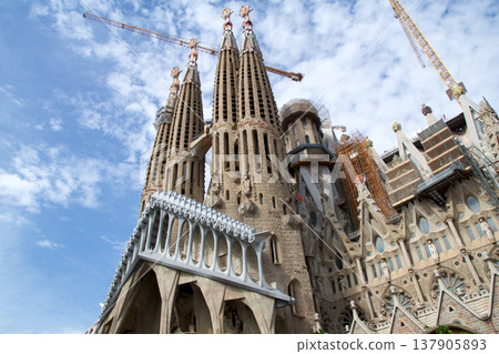 Barcelona, Spain, August 30, 2017: Sagrada Familia under construction with crane Barcelona, Spain, August 30, 2017: Sagrada Familia under construction with crane 137905893