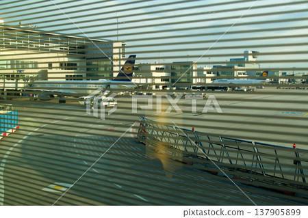 Frankfurt, Germany, 02 September 2017: View over the apron with aircraft from a frequent flyer lounge Frankfurt, Germany, 02 September 2017: View over the apron with aircraft from a frequent flyer lounge 137905899