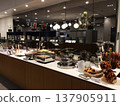 Frankfurt, Germany, 02 September 2017: Buffet with hot food and pretzels in a frequent flyer lounge 137905911