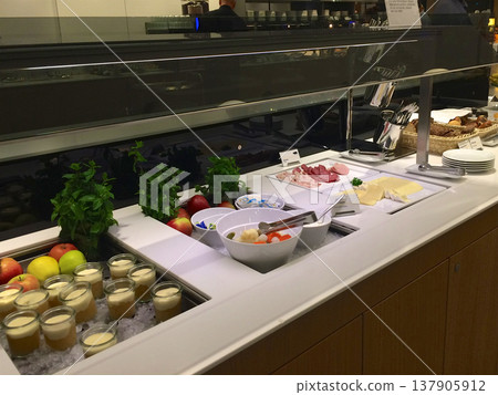 Frankfurt, Germany, 02 September 2017: Buffet with desserts salads and cold cuts in a frequent flyer lounge 137905912