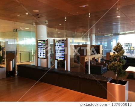 Barcelona, Spain, 02 September 2017: Departure information screens in a frequent flyer lounge Barcelona, Spain, 02 September 2017: Departure information screens in a frequent flyer lounge 137905913