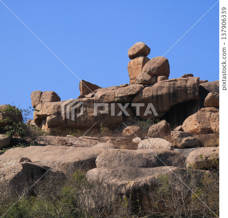 Phallus shaped rock formation near Hampi, Karnataka, India. 137906339