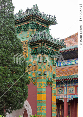 Ornate chinese temple gate pillar with colorful carved details Ornate chinese temple gate pillar with colorful carved details 137906851