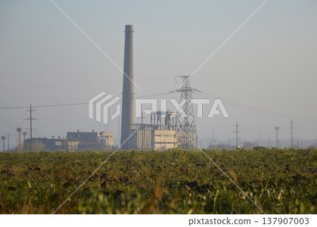 power plant in the rays of the sun at dawn 137907003
