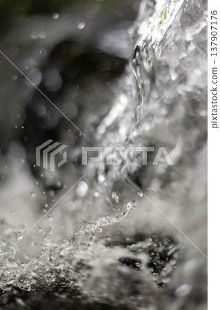 The moment when water splashes like mist - vertical The moment when water splashes like mist - vertical 137907176