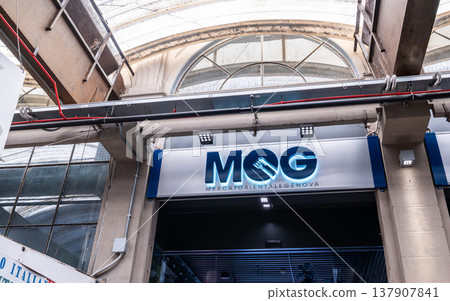 Genoa, liguria, italy. May 18, 2024. Mercato orientale genova mog sign visible, highlighting the entrance to genoa's food market within its historic architectural structure Genoa, liguria, italy. May 18, 2024. Mercato orientale genova mog sign visible, highlighting the entrance to genoa's food market within its historic architectural structure 137907841