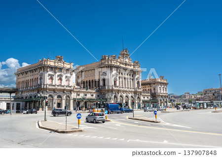 Genoa, liguria, italy. May 18, 2024. Genoa brignole railway station facade standing prominently in the city center with vehicles moving on the surrounding roads Genoa, liguria, italy. May 18, 2024. Genoa brignole railway station facade standing prominently in the city center with vehicles moving on the surrounding roads 137907848