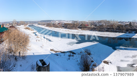 The spring river in the village began to thaw from the ice.The ice in the river began to melt. 137907989