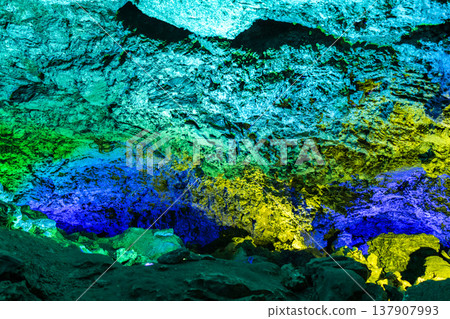 View inside the ancient cave with stone walls with additional lighting View inside the ancient cave with stone walls with additional lighting 137907993