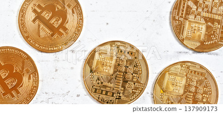 Golden commemorative btc - bitcoin cryptocurrency - coins scattered on white stone board, closeup detail from above Golden commemorative btc - bitcoin cryptocurrency - coins scattered on white stone board, closeup detail from above 137909173