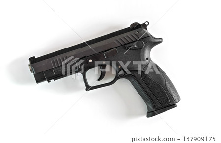 Simple modern black metal gun isolated on white background, view from above 137909175
