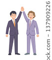 A young man in a suit looks pleased. 137909226
