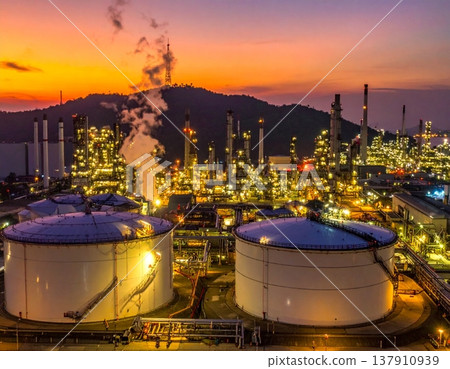 A highly detailed oil refinery, with massive steel pipelines 137910939