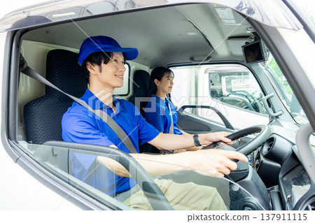 Delivery staff in a car Delivery staff in a car 137911115