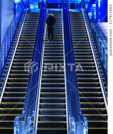 The material of the escalator creates a cold atmosphere. The material of the escalator creates a cold atmosphere. 137911663