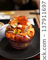 Bowl of rice topped with sashimi  137911697