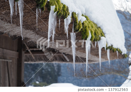 Thatched roof and icicles Thatched roof and icicles 137912563