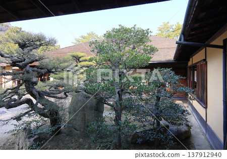 The Hatsutsumi-kan and garden as seen from the tea house at Kikutsuki-tei in the specially designated scenic spot "Ritsurin Garden". The Hatsutsumi-kan and garden as seen from the tea house at Kikutsuki-tei in the specially designated scenic spot "Ritsurin Garden". 137912940