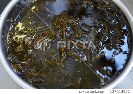 Washing fresh gibasa seaweed 137913952