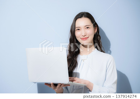 Business advertisement image expressing recruitment and aspirations for talent and careers: light blue background, direct gaze at camera. 137914274