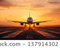 Jet plane landing in the sunset 137914302
