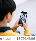 Boys using their smartphones 137914306