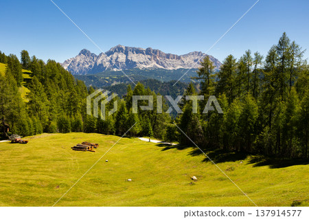 Wooden farm building on hillside in area pass Goma Dolomites Wooden farm building on hillside in area pass Goma Dolomites 137914577