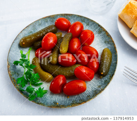 Appetizing pickled cucumbers and tomatoes Appetizing pickled cucumbers and tomatoes 137914953