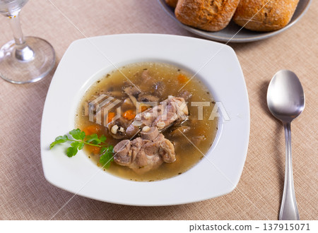 Pearl barley soup with pork and mushrooms 137915071