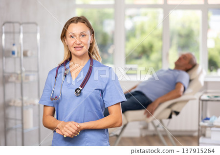 Confident professional female doctor standing in medical office Confident professional female doctor standing in medical office 137915264