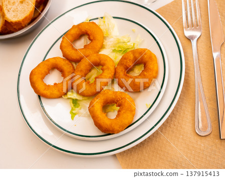 Calamares a la romana is popular dish of Spanish cuisine Calamares a la romana is popular dish of Spanish cuisine 137915413