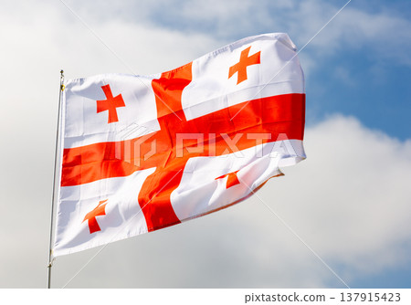 Flag of Georgia on background of sky Flag of Georgia on background of sky 137915423
