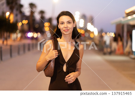 Young woman walking on promenade of Barceloneta Young woman walking on promenade of Barceloneta 137915465