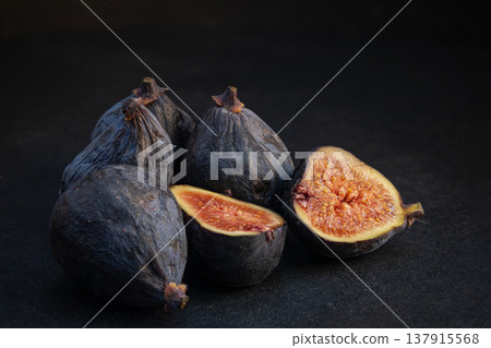 Ripe fresh figs on dark background Ripe fresh figs on dark background 137915568
