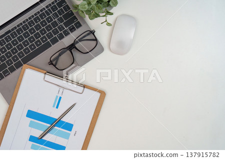 Minimal desk setup with laptop and clipboard Minimal desk setup with laptop and clipboard 137915782