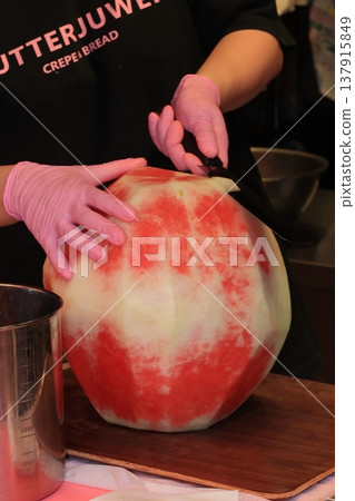 A large watermelon that is peeled whole. 137915849