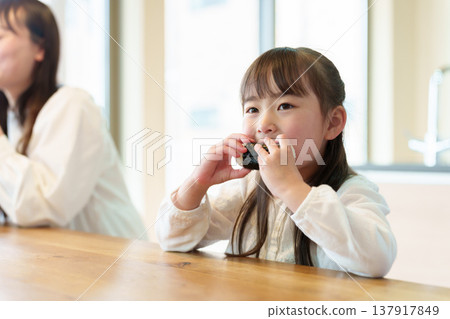 A girl who eats onigiri A girl who eats onigiri 137917849
